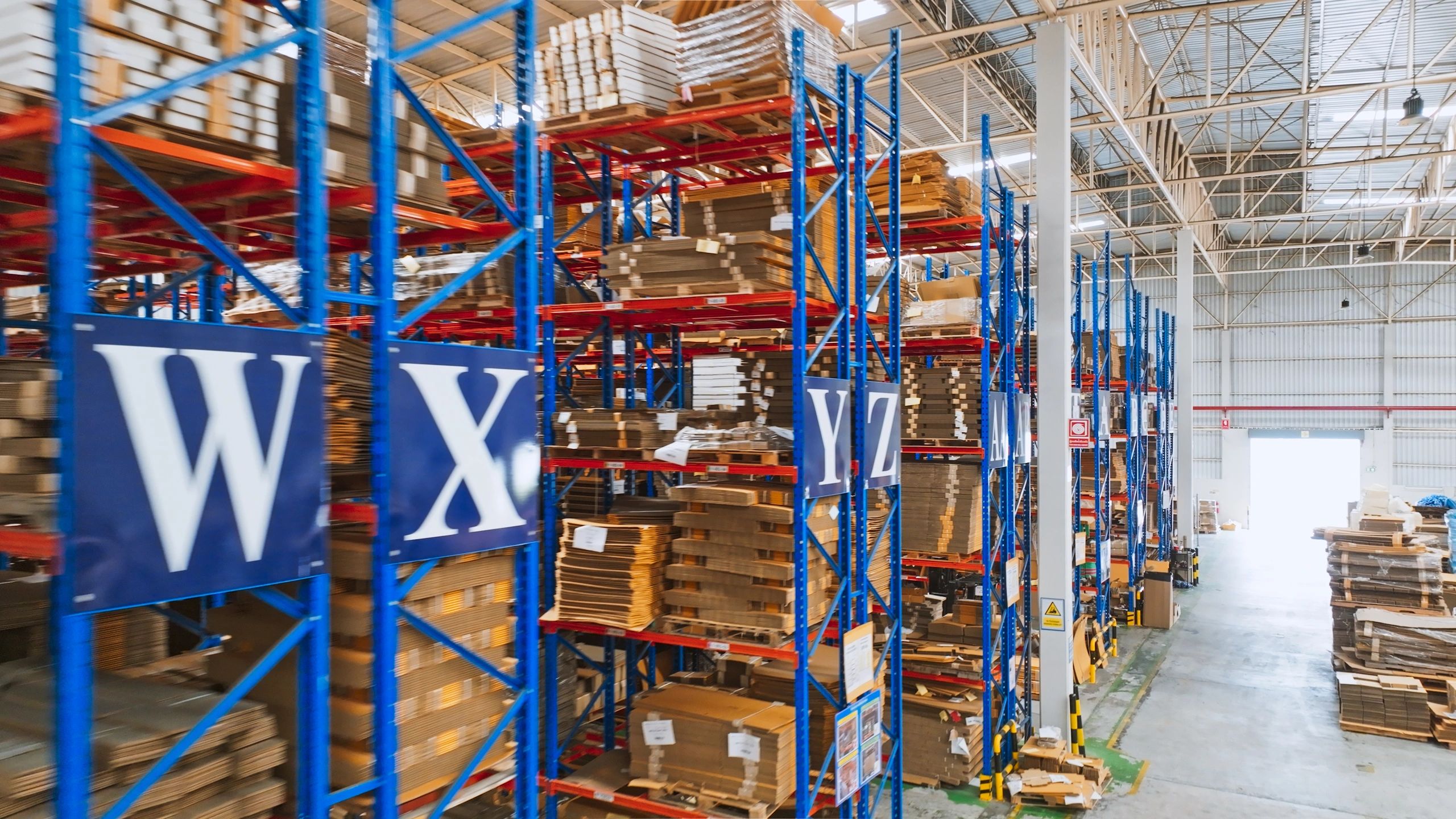 Packages on warehouse shelving ready for shipping