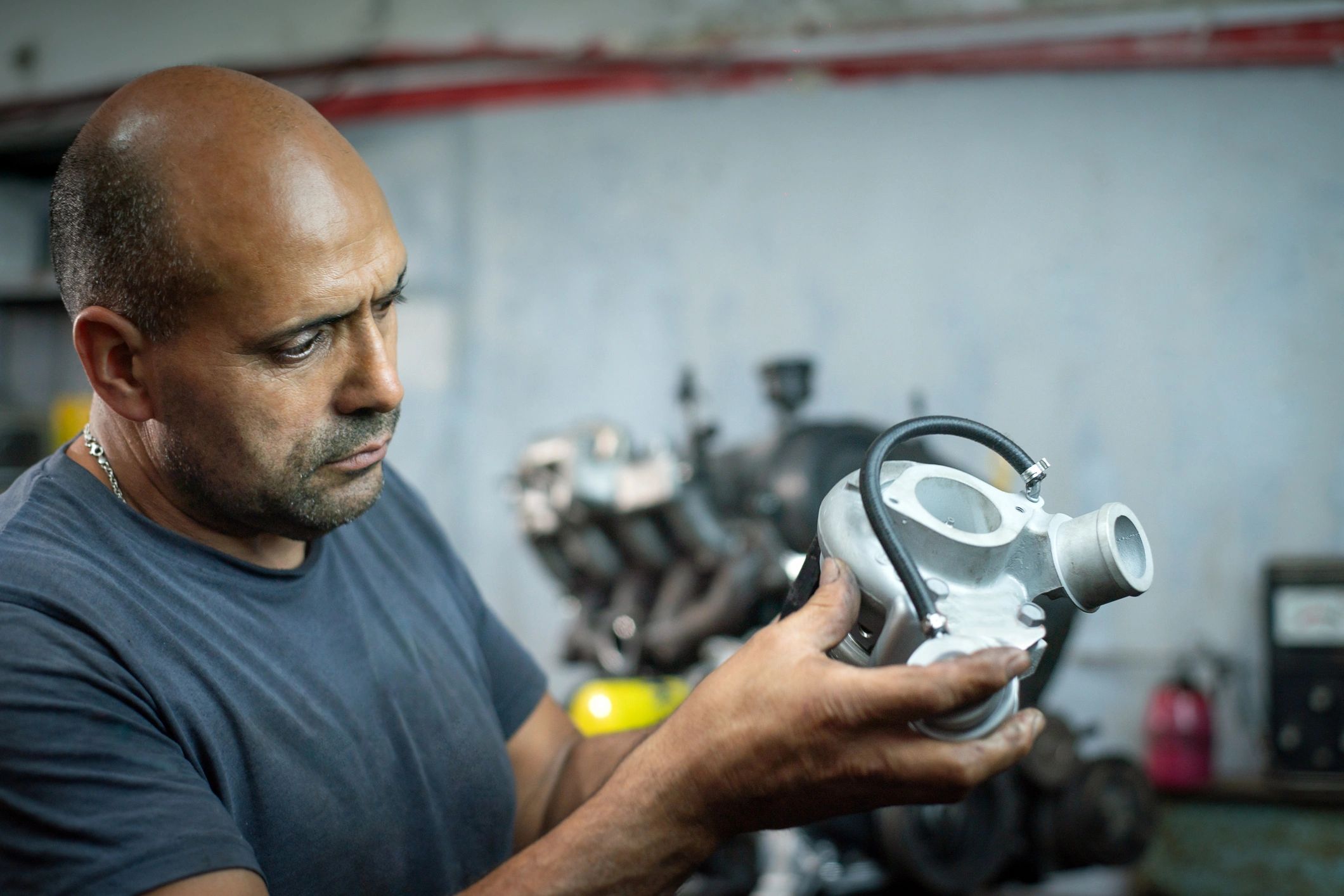 Mechanic inspecting an engine component