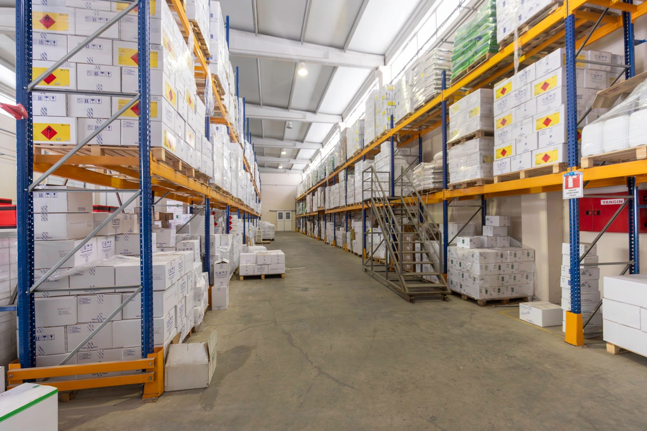Warehouse aisle with shelves and boxes