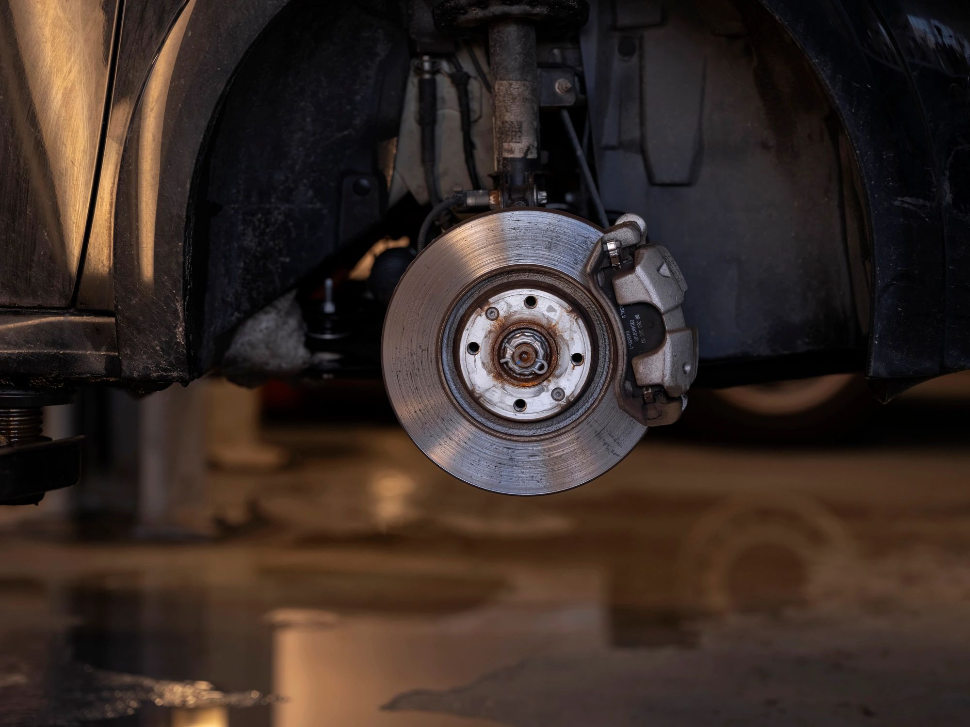 Close-up of brake rotor and caliper assembly