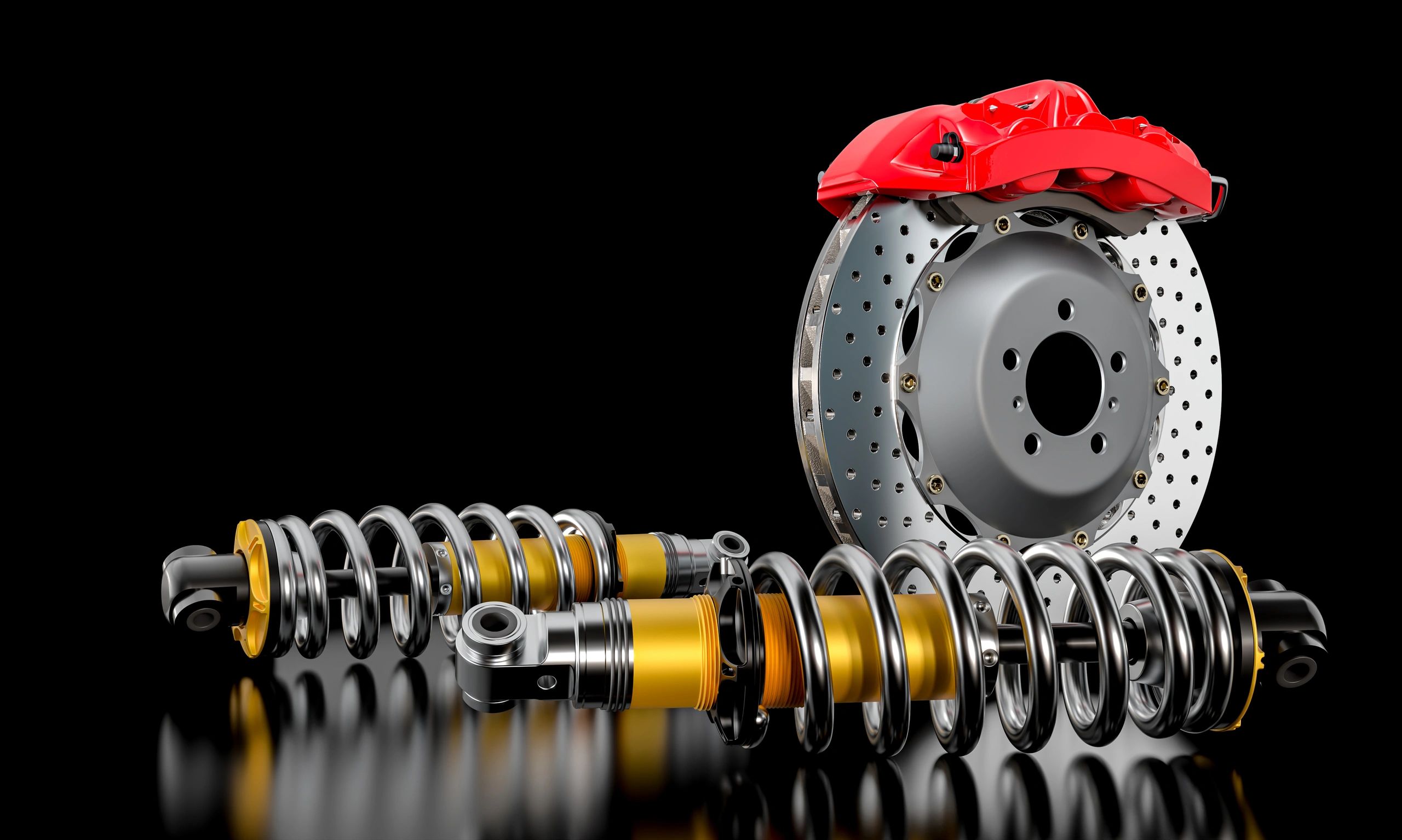 Brake disc with red caliper and shock absorbers on black background